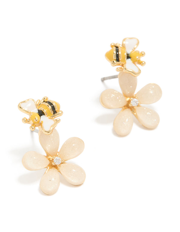 Showcasing dainty stud earrings featuring bee design with floral pink flower crafted from enamel in gold plated finish front view