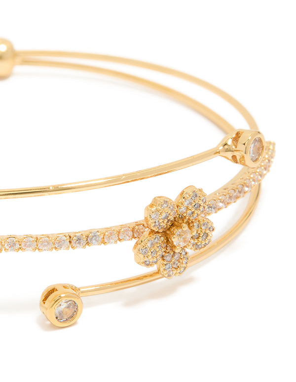 Stunning gold plated cubic zirconia flower wrist cuff showcasing floral with crystal embellishments gold close up view