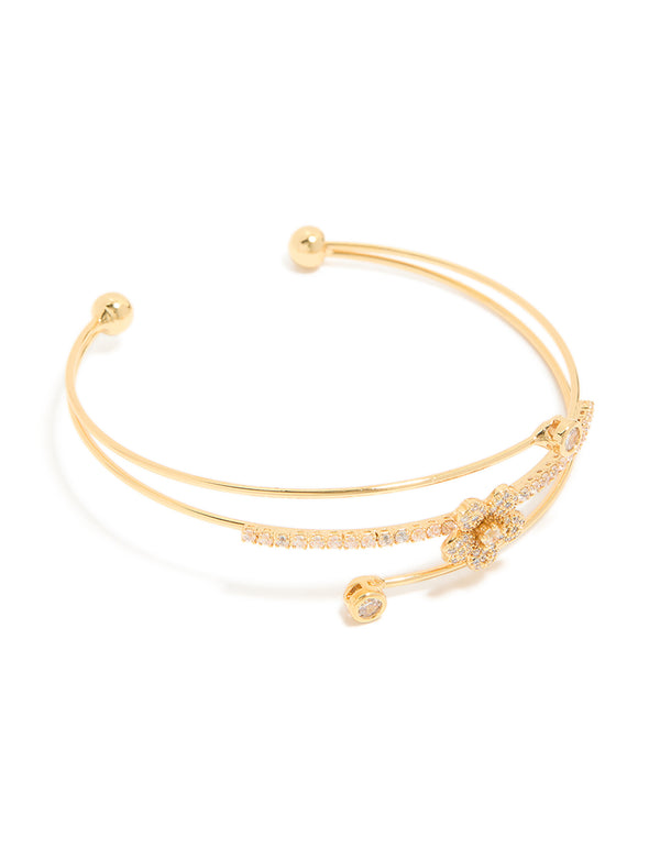 Elegant gold plated cubic zirconia flower wrist cuff featuring with crystal embellishments in gold front view