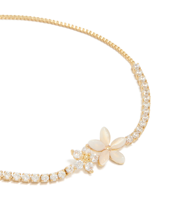 Showcasing the gold plated cubic zirconia flower toggle bracelet featuring intricate floral design close up view