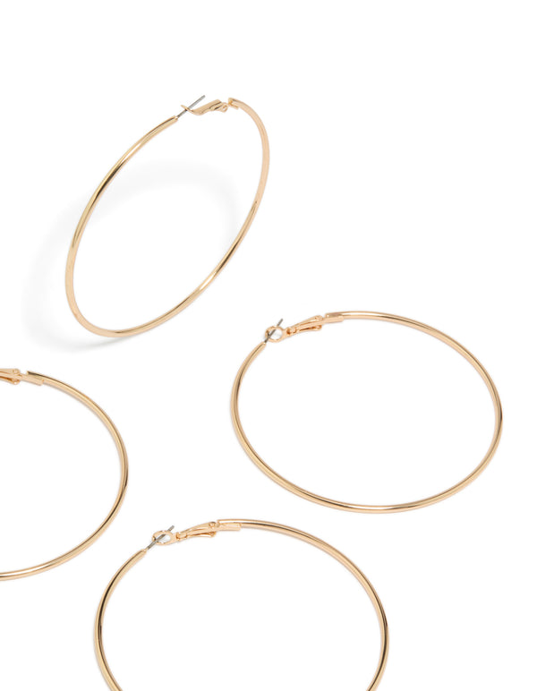 Showcasing gold large hoop earrings 2-pack with statement styling and clasp detail view