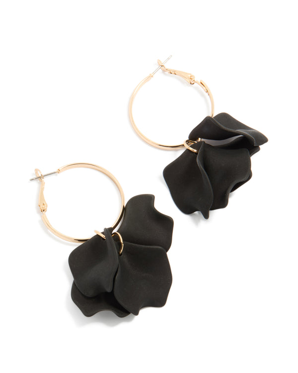 Statement gold hoop earrings featuring black acrylic petal drops front view