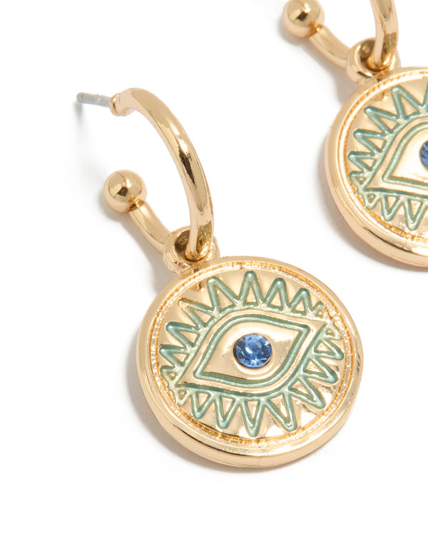 Crafted from gold, this dainty evil eye pendant huggie earrings features huggie closure and turquoise dodgerblue details close up view