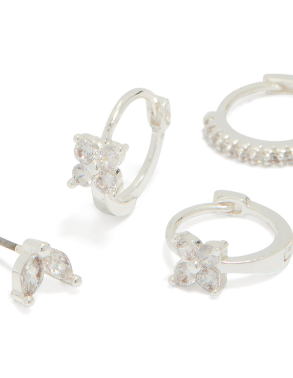 Featuring silver plated flower huggie and leaf stud earrings in a 3-pack close up view