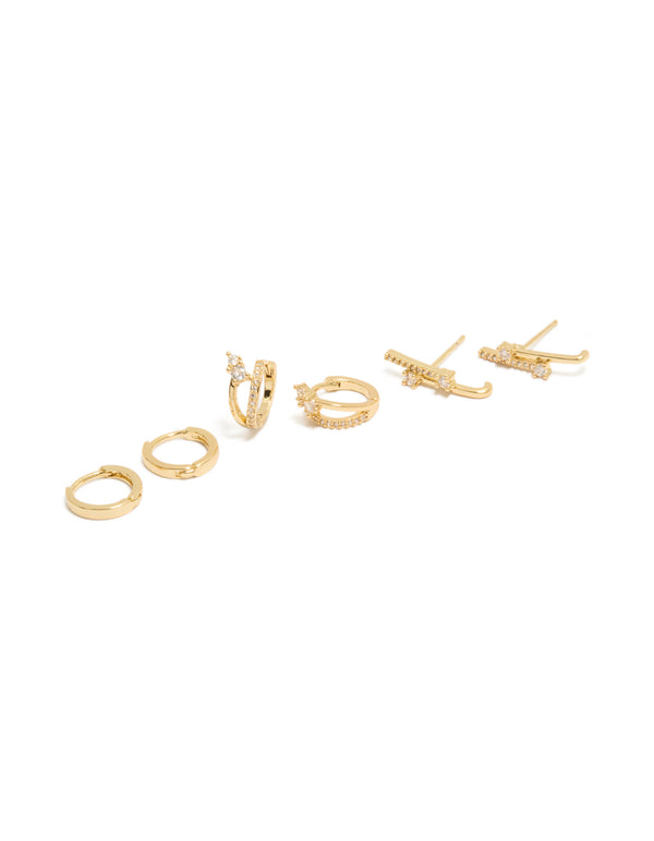 Showcasing gold plated studs and double cuff huggie earrings featuring cubic zirconia crystals in a 3-pack front view