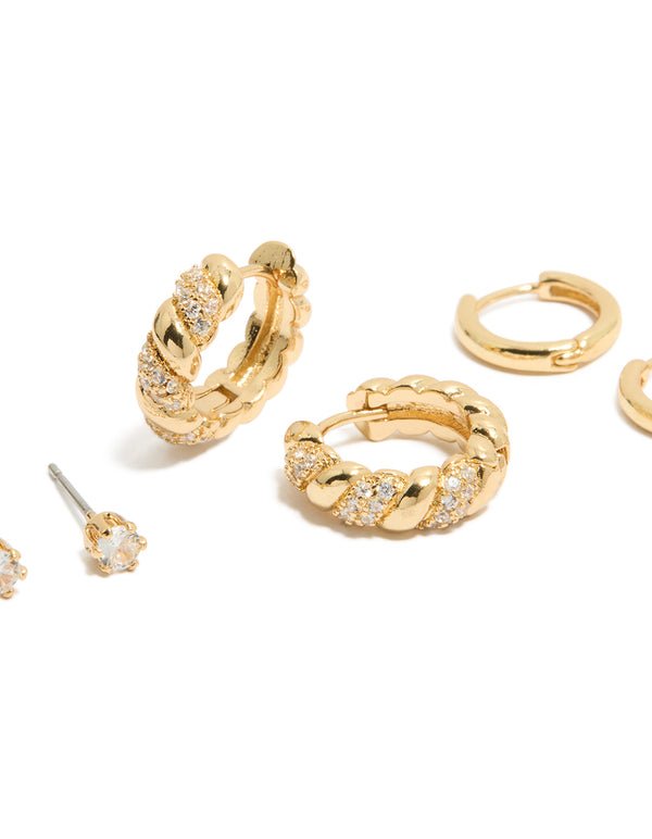 Elegant gold plated mini twist huggie and stud earrings with cubic zirconia crystals in a 3-pack set close up view