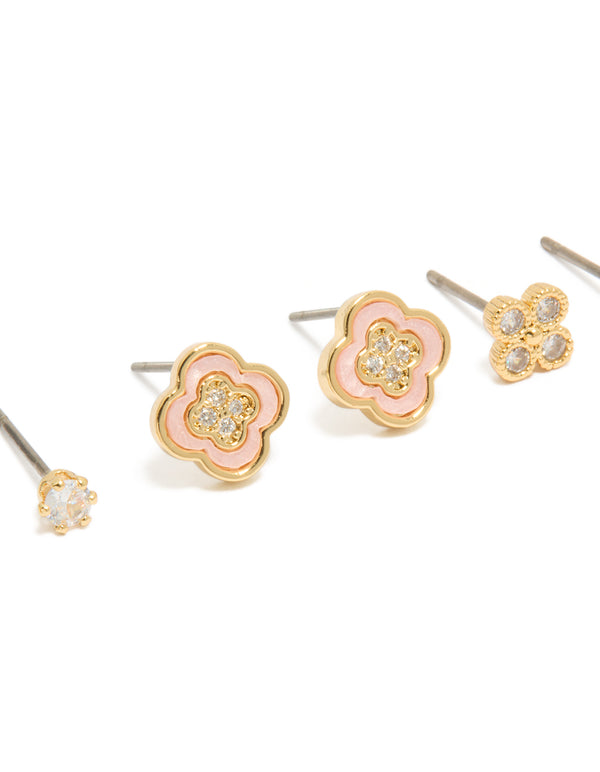 Featuring gold plated cubic zirconia flower stud earrings in a 3-pack and crystal accents close up view