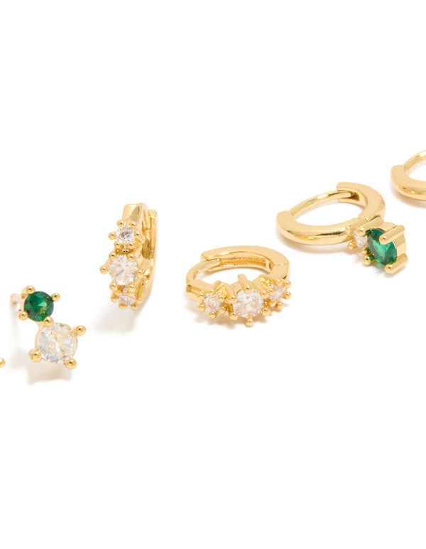 Featuring gold plated green and clear cubic zirconia stud and huggie earrings in a 3-pack close up view