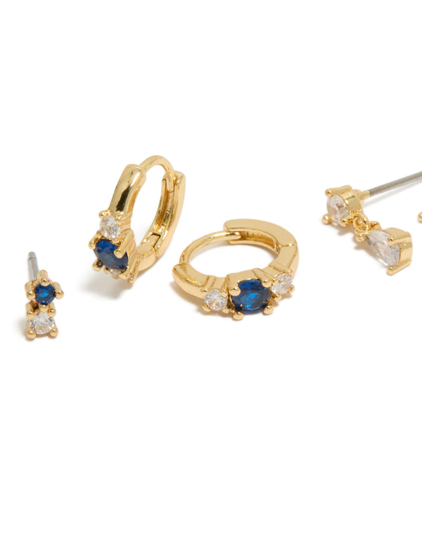 Detailed view of gold plated mixed cut blue cubic zirconia mini earrings 3-pack featuring crystal and huggie closure close up view