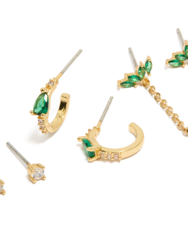 Stunning statement earrings in a 3-pack showcasing gold plated finish with pear, marquise stone cuts, cubic zirconia and crystal details, stud and hoop closures, green and clear tones close up view