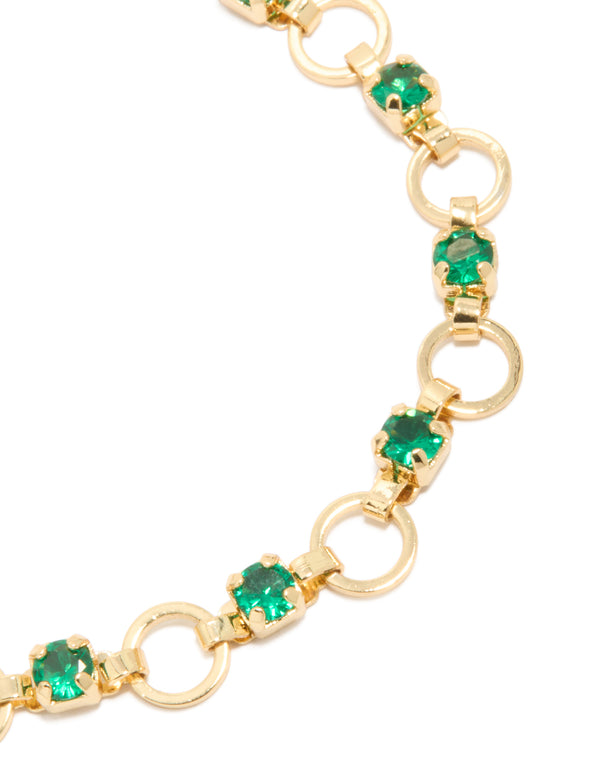 Detailed view of gold plated alternating round green cubic zirconia link bracelet close up view