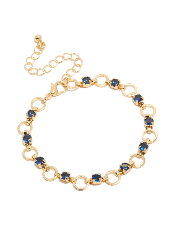 Presenting a gold plated blue cubic zirconia alternating round link bracelet featuring stone cut details and closure front view