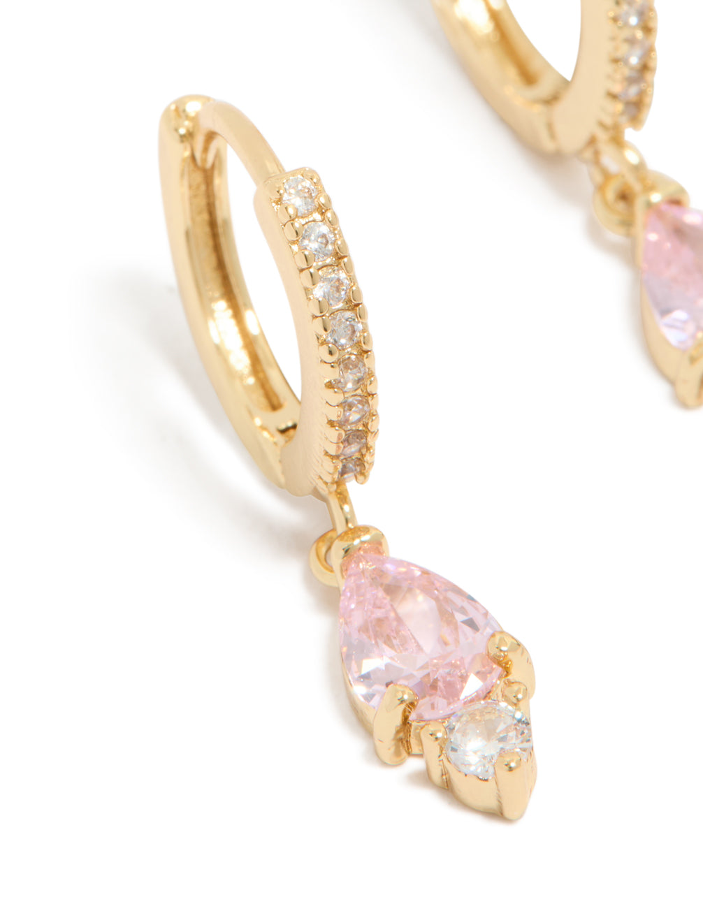 Featuring dainty gold plated pink cubic zirconia huggie earrings with hoop closure close up view