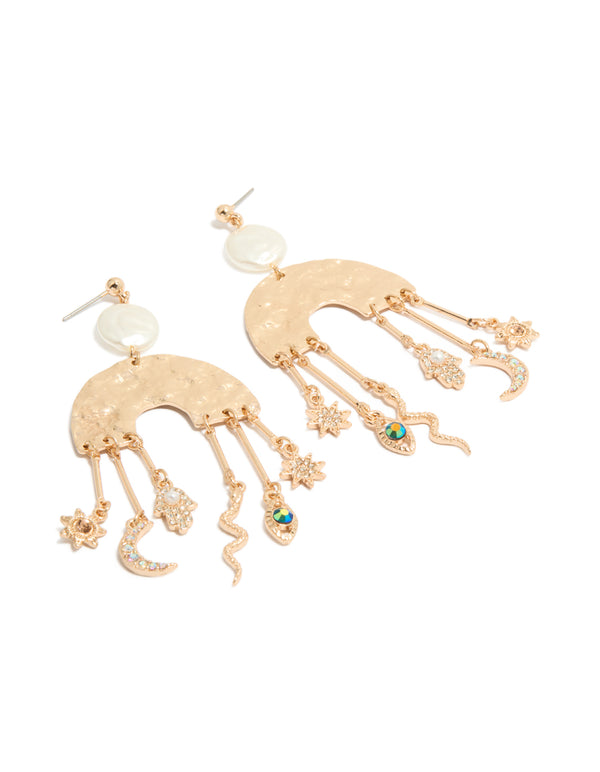 Showcasing brushed gold rainbow and celestial charm drop earrings in a statement style, featuring moon, pearl, star, sun, snake, and hamsa hand charms front view