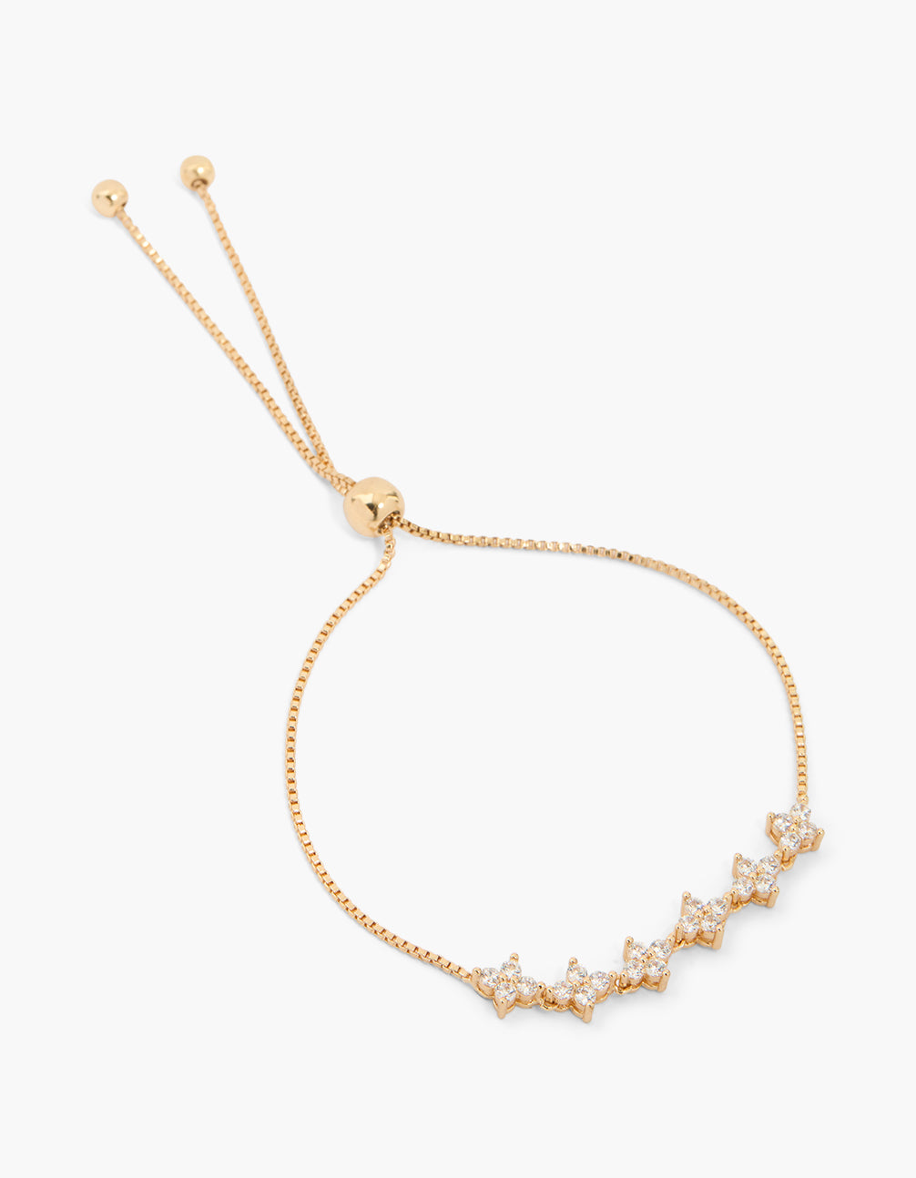 Stunning cubic zirconia flower tennis toggle bracelet in gold with adjustable closure front view