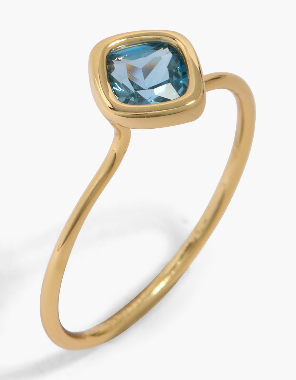 Elegant solitaire blue cubic zirconia ring crafted from gold plated sterling silver with crystal detail front view