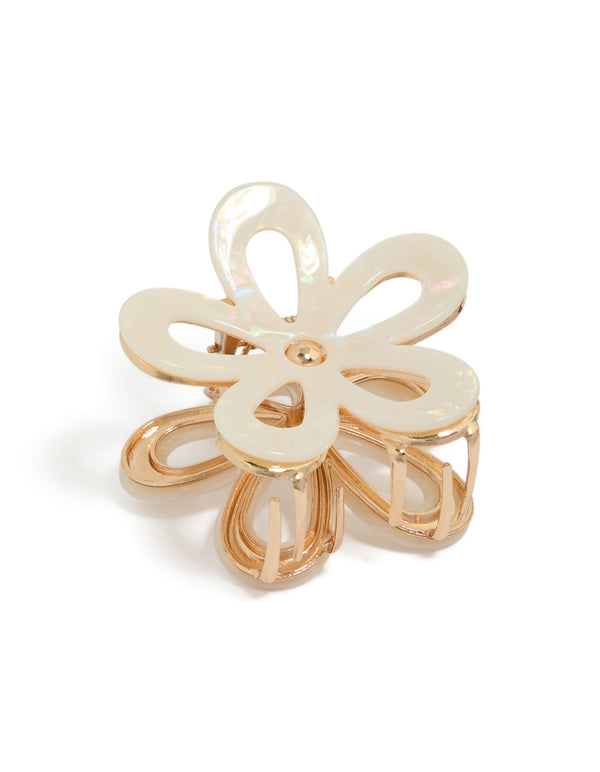 Showcasing a gold iridescent flower outline claw clip front view