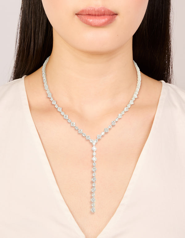 Showcasing a silver plated cubic zirconia square tennis Y-necklace on neck view