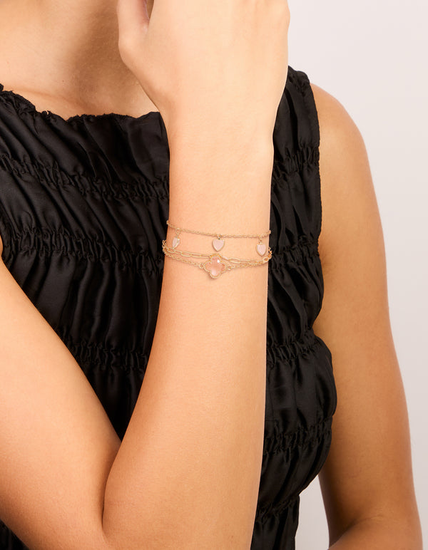 Featuring gold pink diamante flower and heart chain bracelets in a 3-pack charm details and enamel material on wrist view