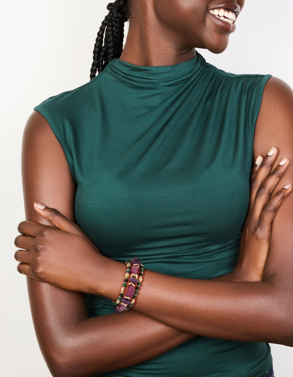 Featuring beads and balls in dark magenta, gold, green, and black, this chunky 3-pack of mixed stretch bracelets is shown on model view