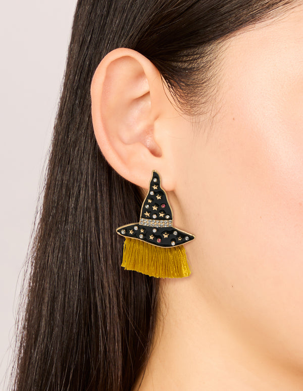 Stylish gold witch hat drop earrings with celestial star and tassel accents on ear view