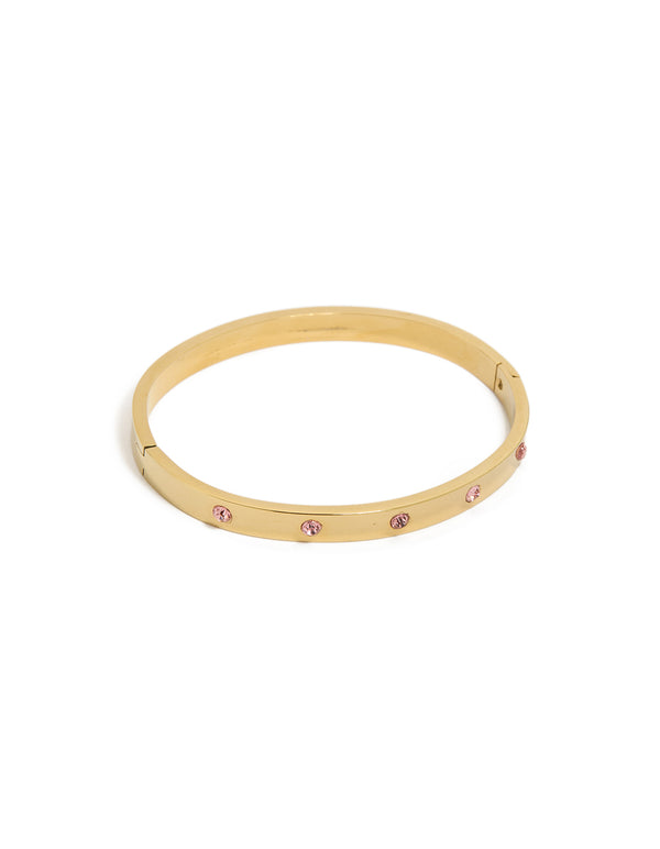 Showcasing a waterproof gold plated stainless steel hinged bracelet featuring pink diamante accents front view