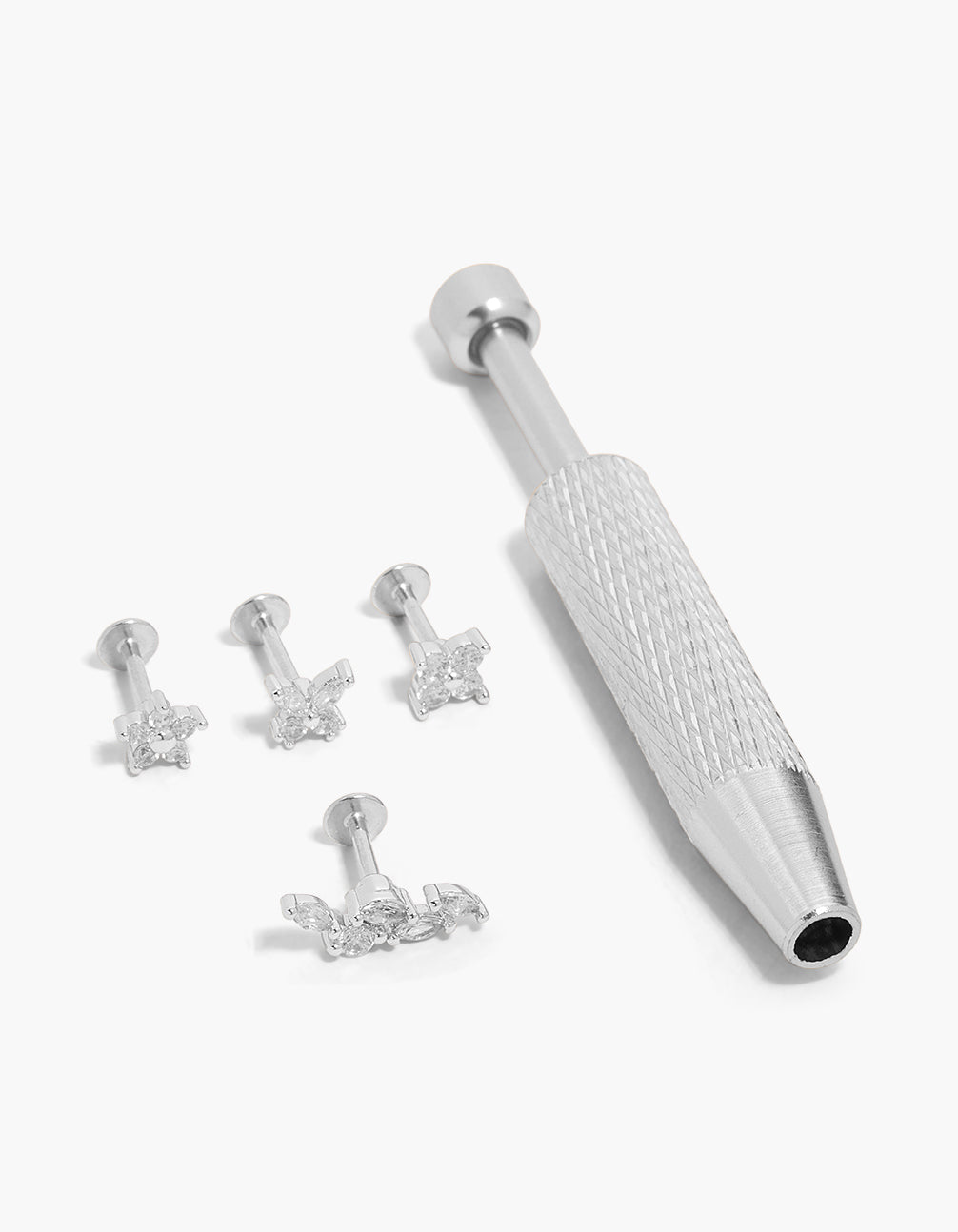 Discover this dainty stud flat back surgical steel tool and floral studs pack featuring cubic zirconia with clear accents in a silver finish front view