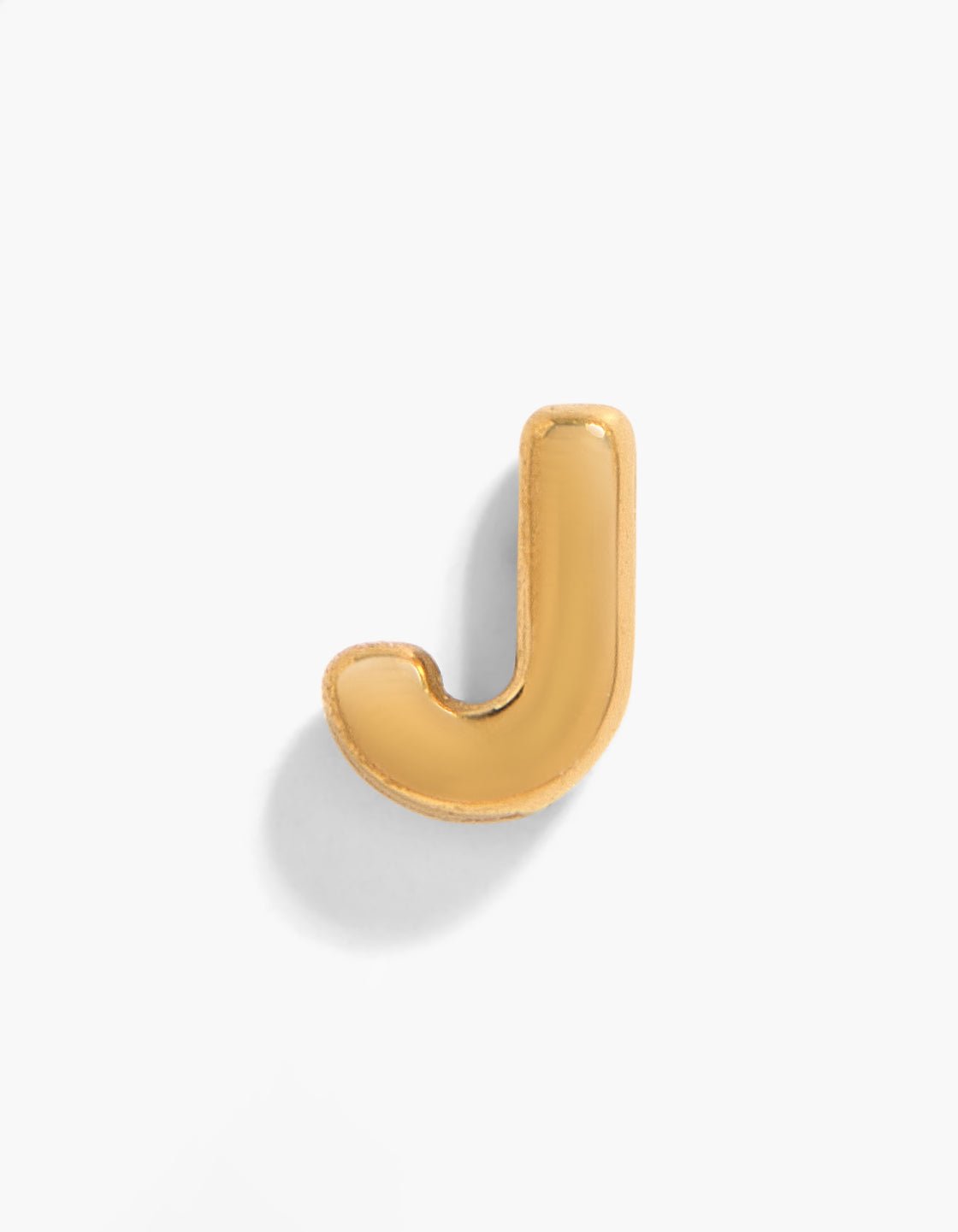 Showcasing a gold plated titanium letter J single threadless flat back stud featuring initial detail in gold front view