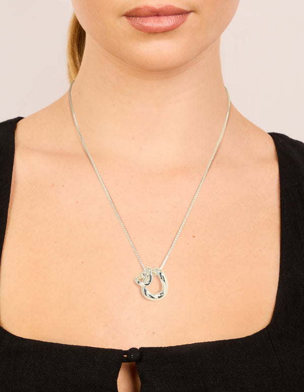 Elevate your look with this silver plated small double organic pendant necklace in dainty design on neck view