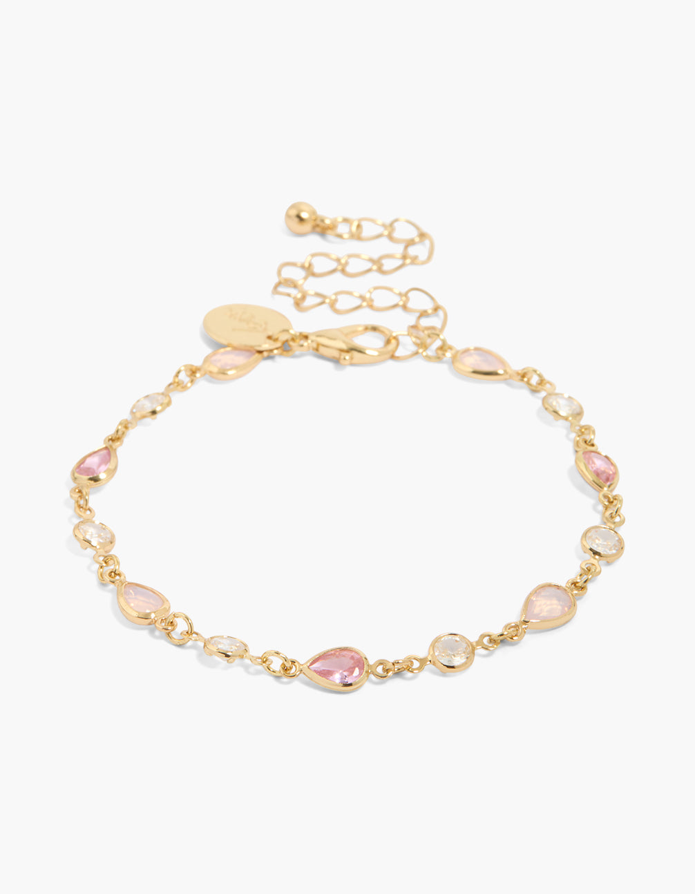Showcasing a gold plated bracelet featuring pink cubic zirconia in alternating round and oval stone front view