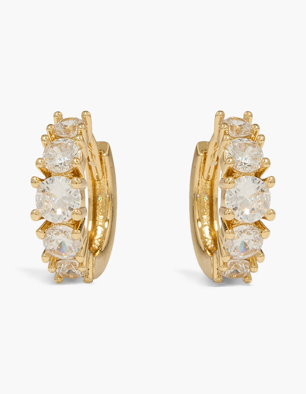 Showcasing classic huggie earrings featuring cubic zirconia stones in a gold plated finish front view