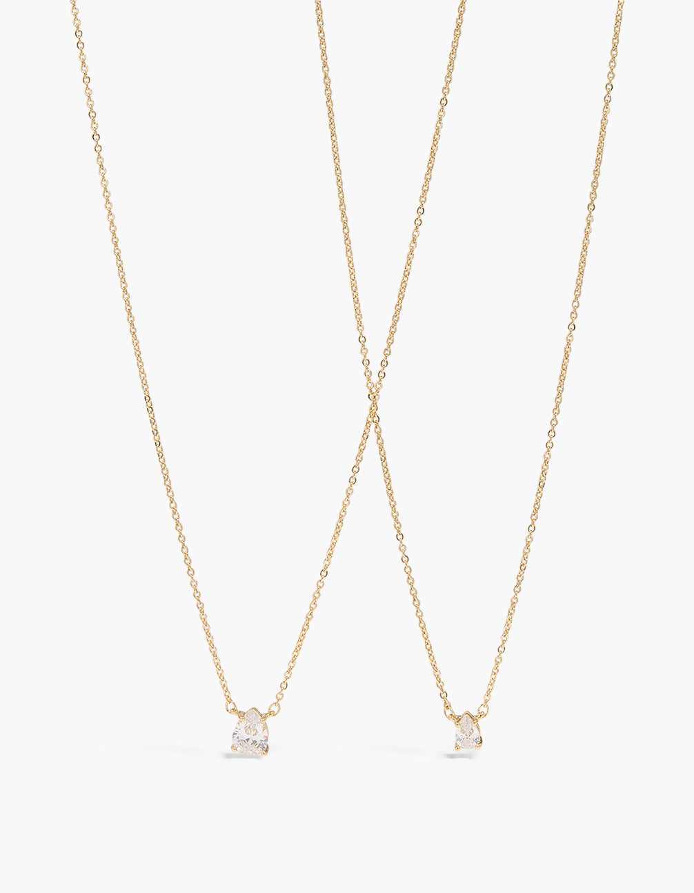 Discover these gold plated pear cubic zirconia pendant necklaces in a 2-pack featuring crystal details front view