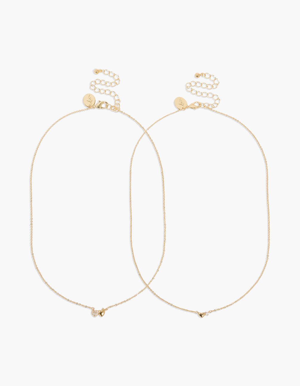 Showcasing gold plated cubic zirconia heart pendant necklaces 2-pack with charm featuring statement design and clasp detail view