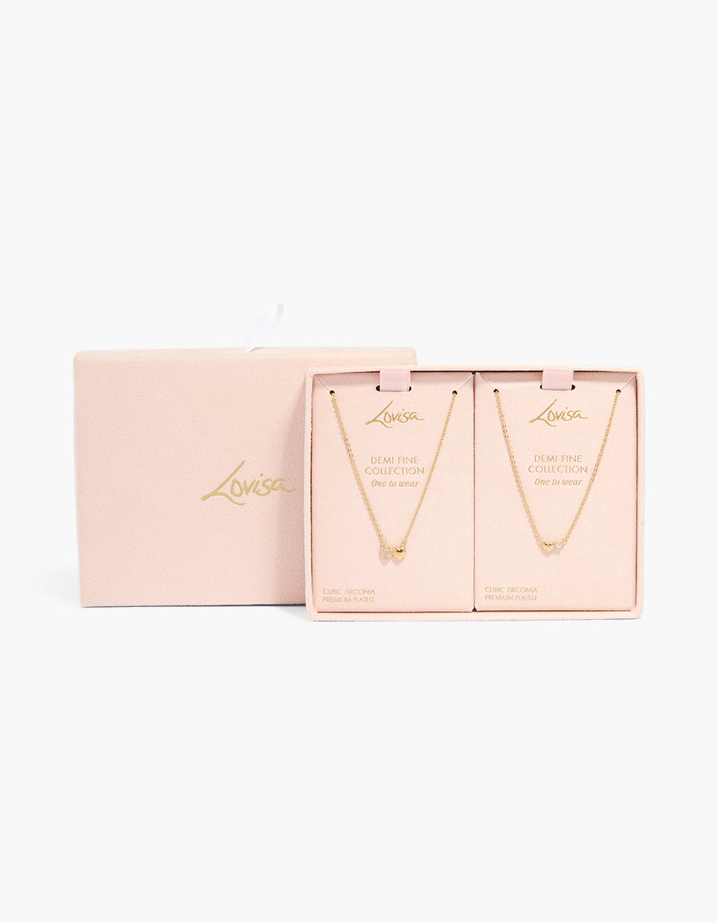 Delicately designed gold plated cubic zirconia heart pendant necklaces 2-pack with charm and statement style in packaging close up view