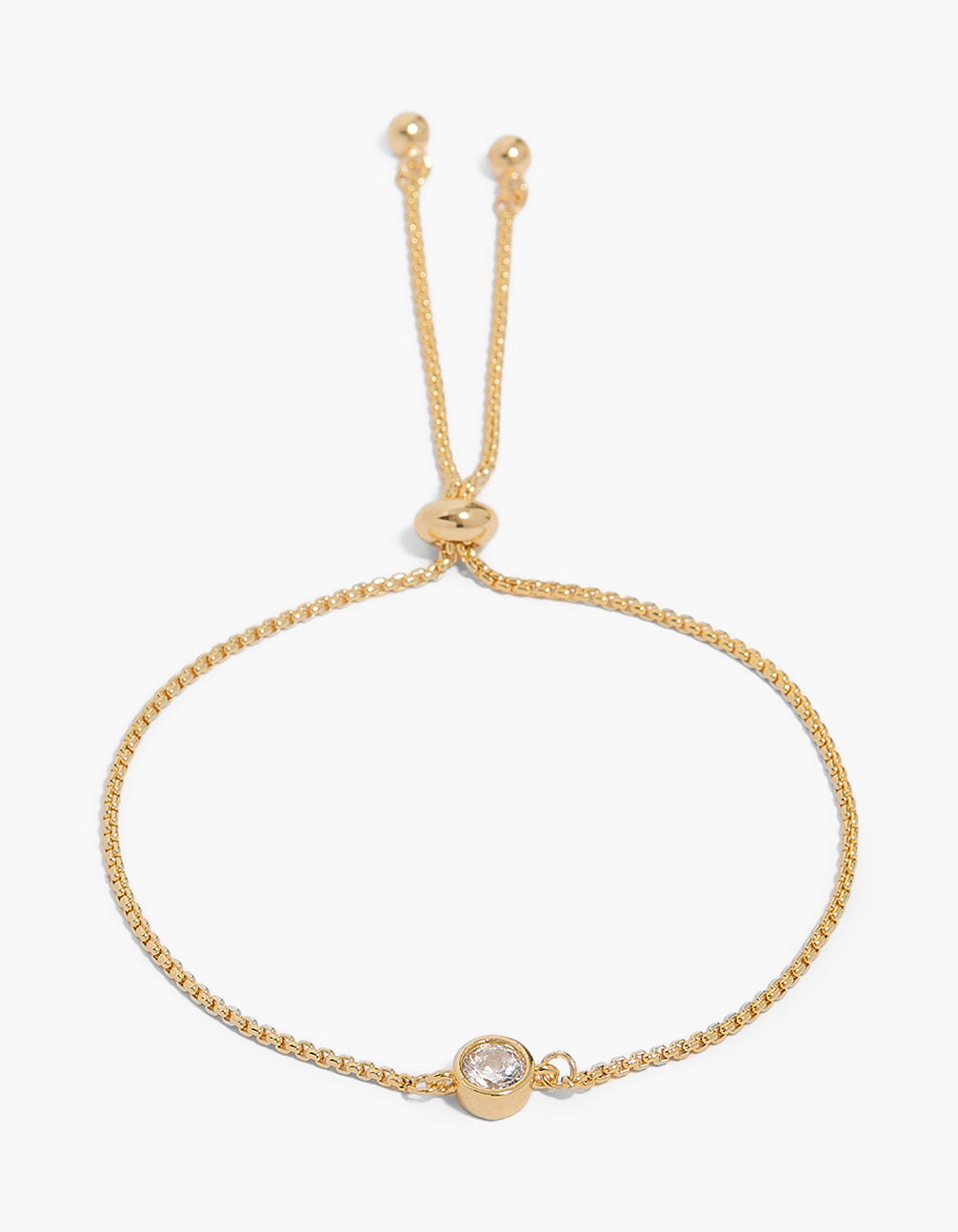 Showcasing a gold bezel round cubic zirconia toggle bracelet featuring with crystal accents in plated metal front view