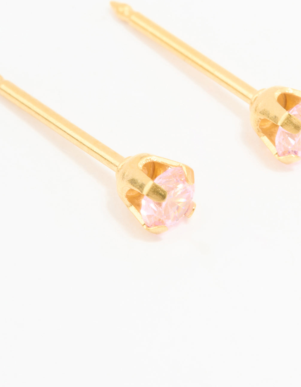 Highlighting 24K gold plated surgical steel 3MM pink cubic zirconia piercing studs close up view
