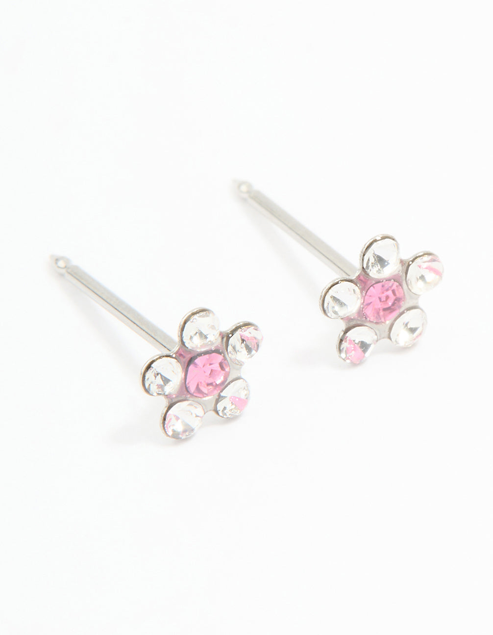 Discover dainty floral stud piercing earrings featuring pink and clear cubic zirconia set in surgical stainless steel front view
