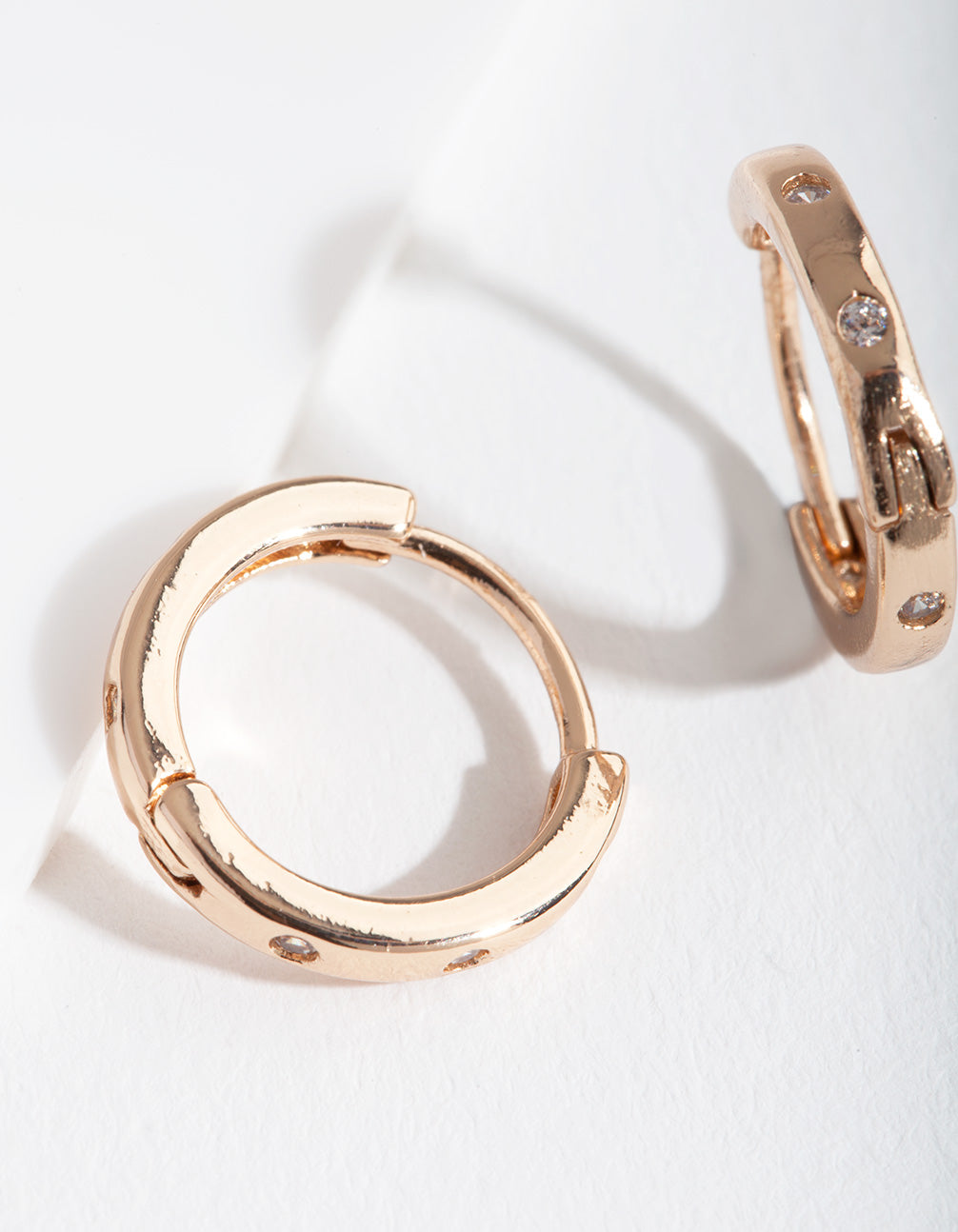 Gold Spaced Cubic Zirconia Huggie Earrings