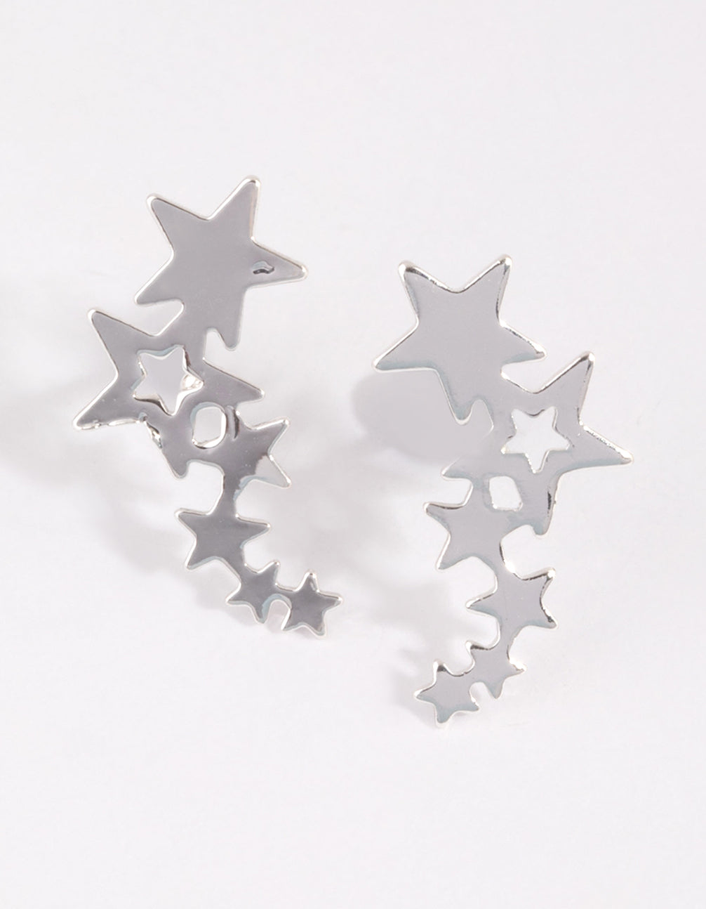 Showcasing silver star crawler earrings with celestial details front view
