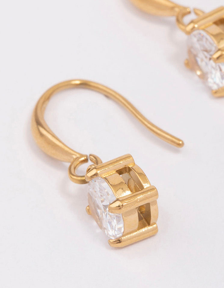 Highlighting waterproof solitaire french hook earrings crafted from gold plated stainless steel featuring cubic zirconia in white close up view