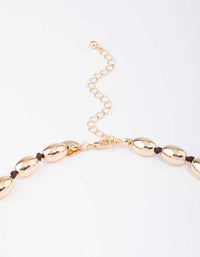 Gold Oval Bead Graduating Cord Necklace - link has visual effect only