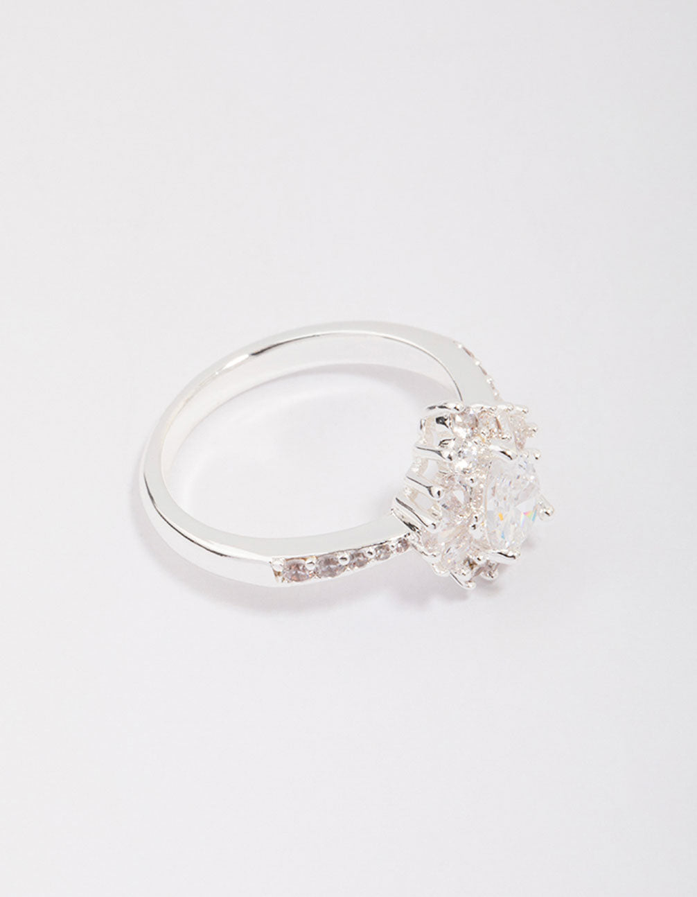 Showcasing a silver plated regal pear ring with stone cut detail front view