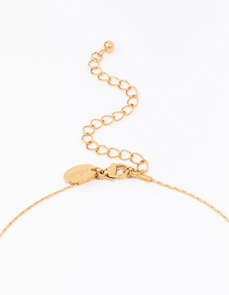 Highlighting a waterproof thin pendant necklace with charm featuring baguette and round stone cut crafted from cubic zirconia, gold plated stainless steel clasp detail view