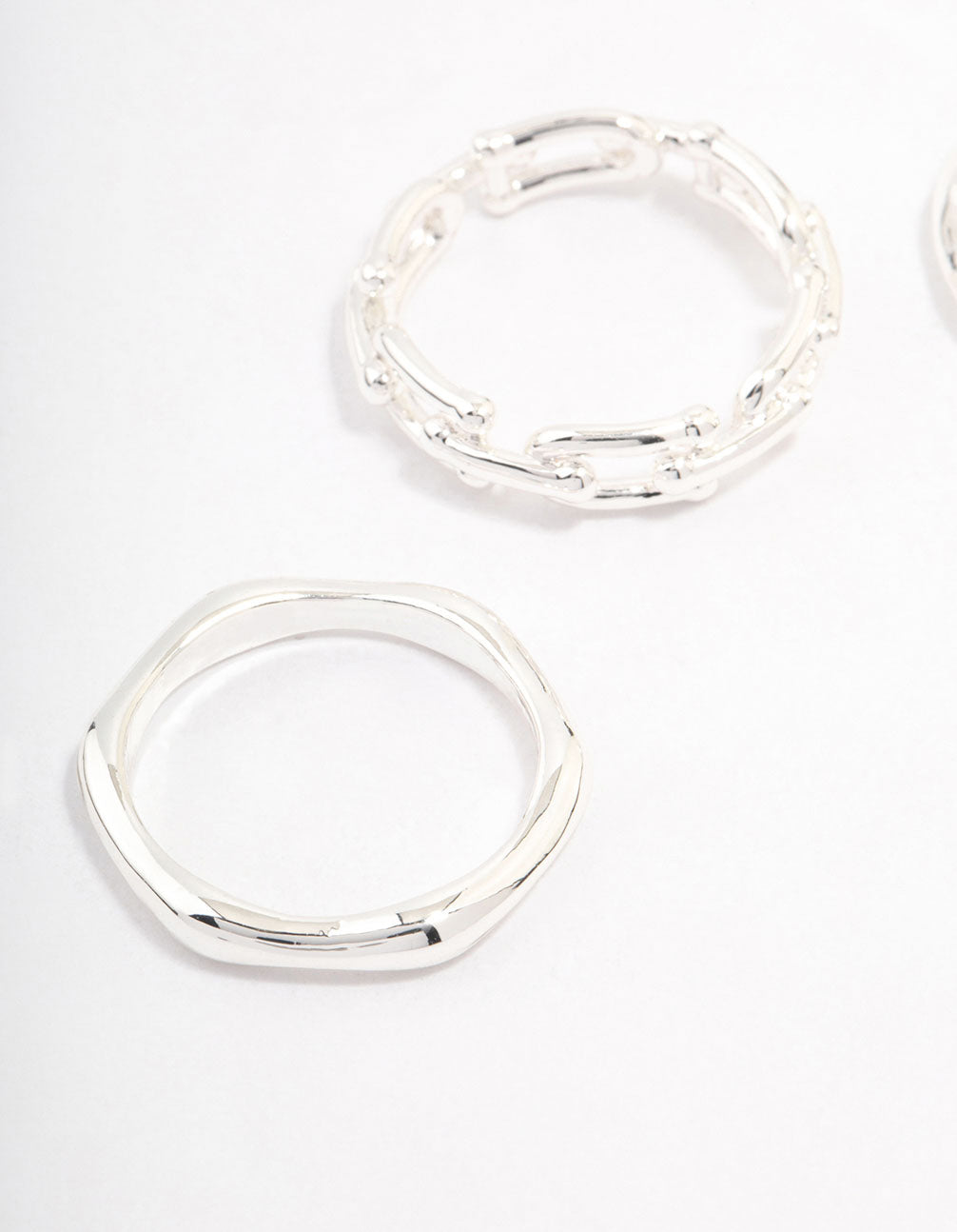 Crafted from silver plated material, this chain link stacking ring pack close up view
