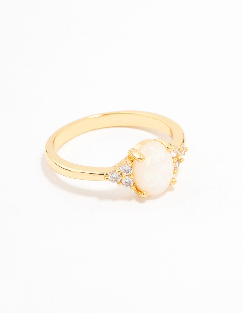 Showcasing a gold plated mystical oval ring with dainty styling and ivory white stones side detail view
