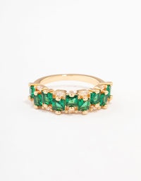 A gold plated staggered band ring crafted with emerald cut cubic zirconia in dark green close up view - link has visual effect only