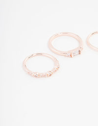 Featuring baguette and round cuts, this rose gold plated cubic zirconia ring 3-pack is shown from a side detail view - link has visual effect only
