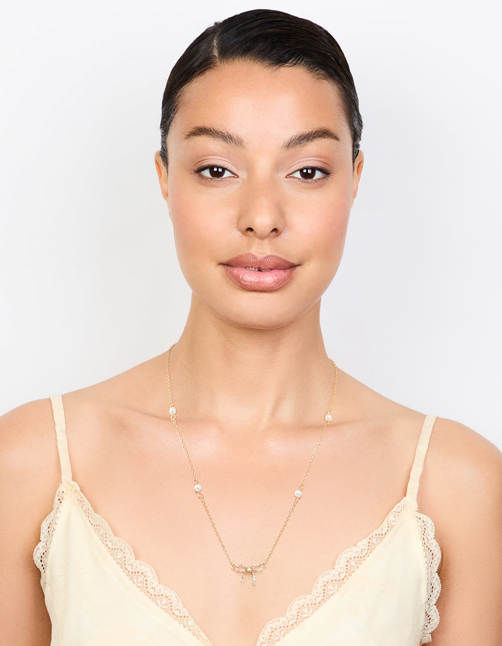 Gold Plated Station Pearl Diamante Bow Pendant Necklace