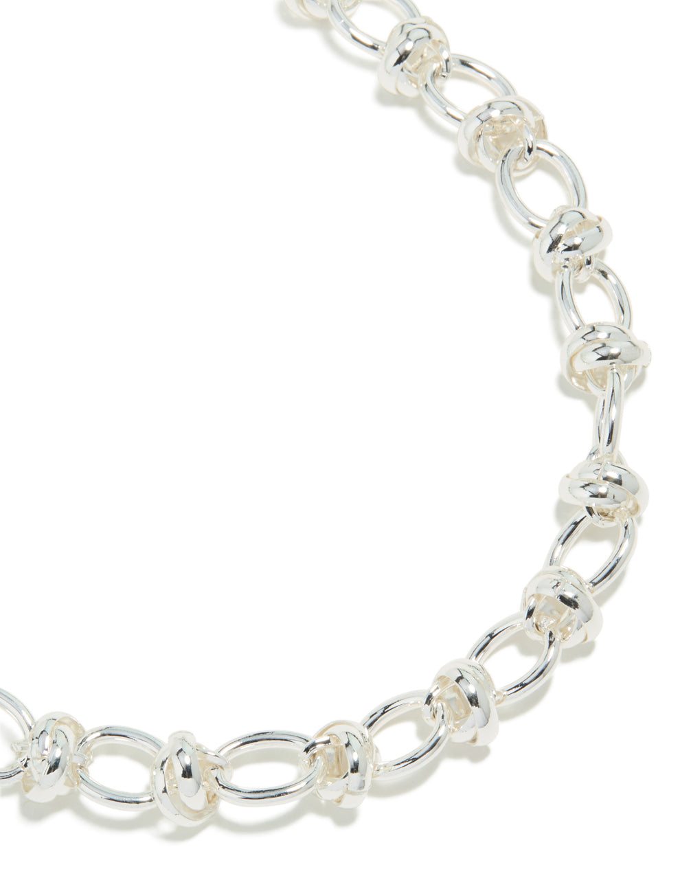 Showcasing a silver plated knotted chain necklace close up view