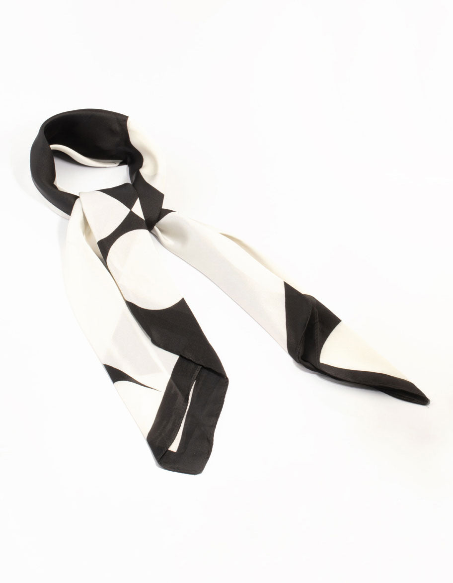 Discover this classic black geometric fabric scarf featuring white print front view
